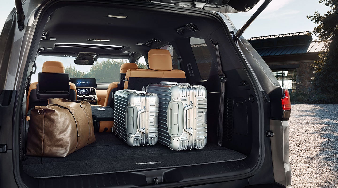 Detail shot of the open trunk of the 2022 Lexus LX 600 with luggage. | Lexus of Louisville in Louisville KY